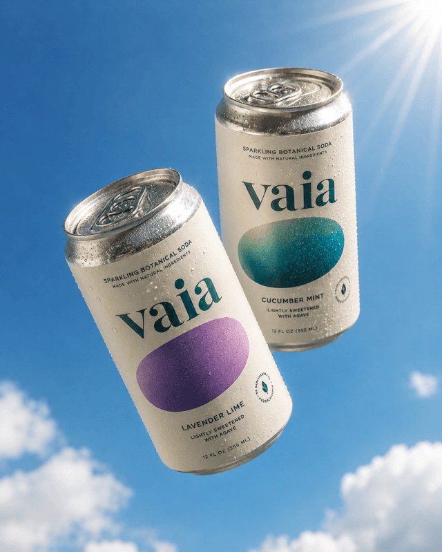 Duo of botanical soda cans floating against a summer sky